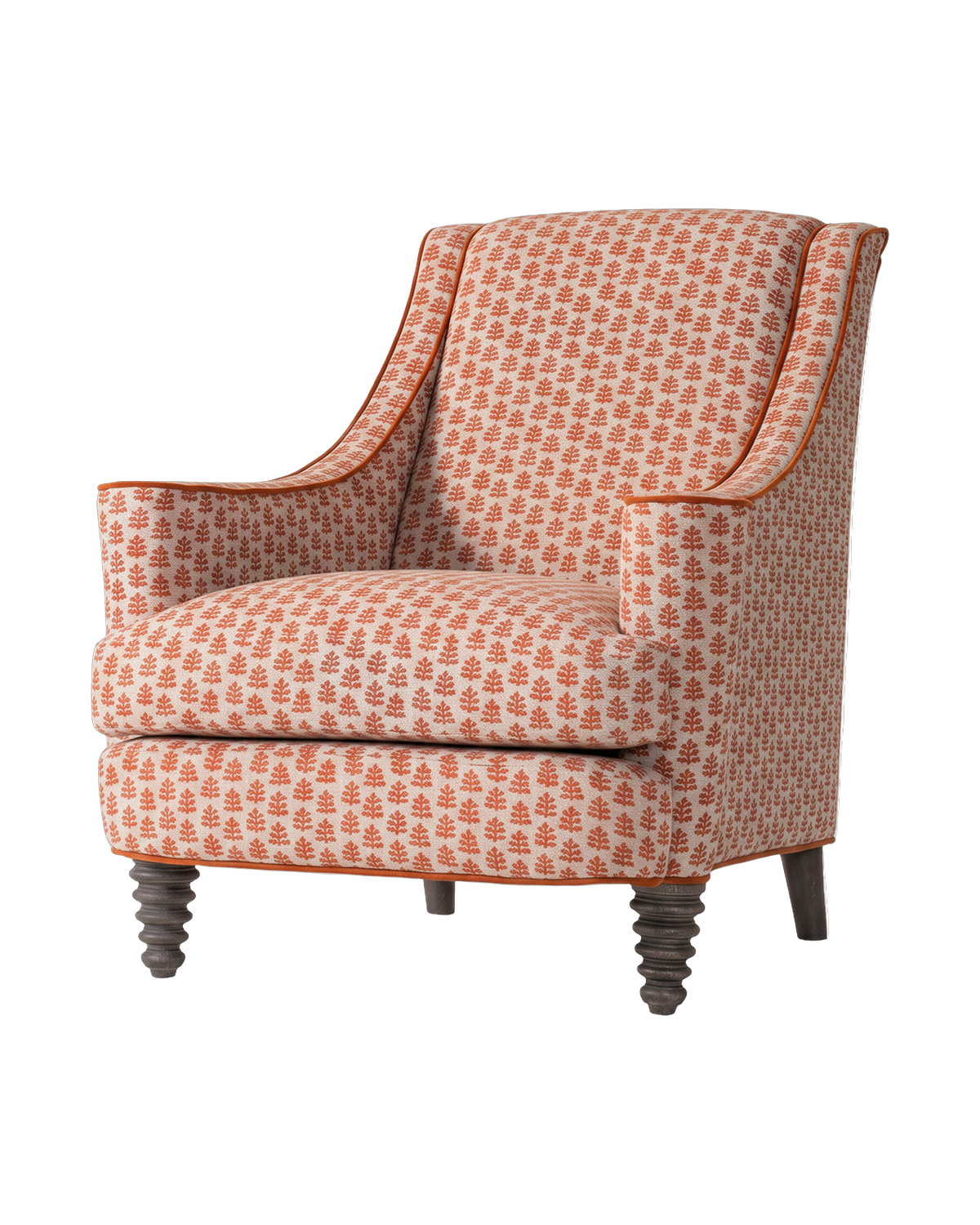 A block-print upholstered armchair with turned legs
